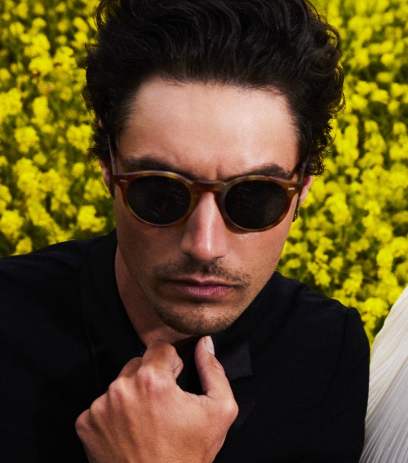 Taking the spotlight in Oliver Peoples' summer 2023 campaign, Levi Dylan wears Gregory Peck Sun sunglasses. 