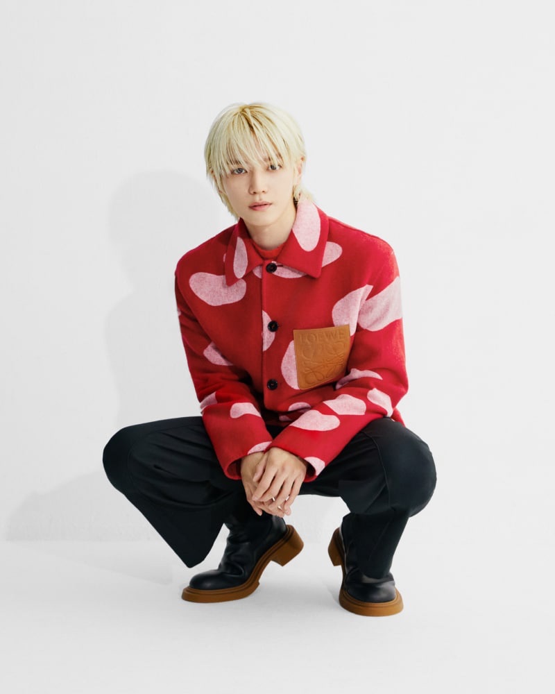 Loewe global brand ambassador Taeyong makes a statement in a graphic red jacket. 