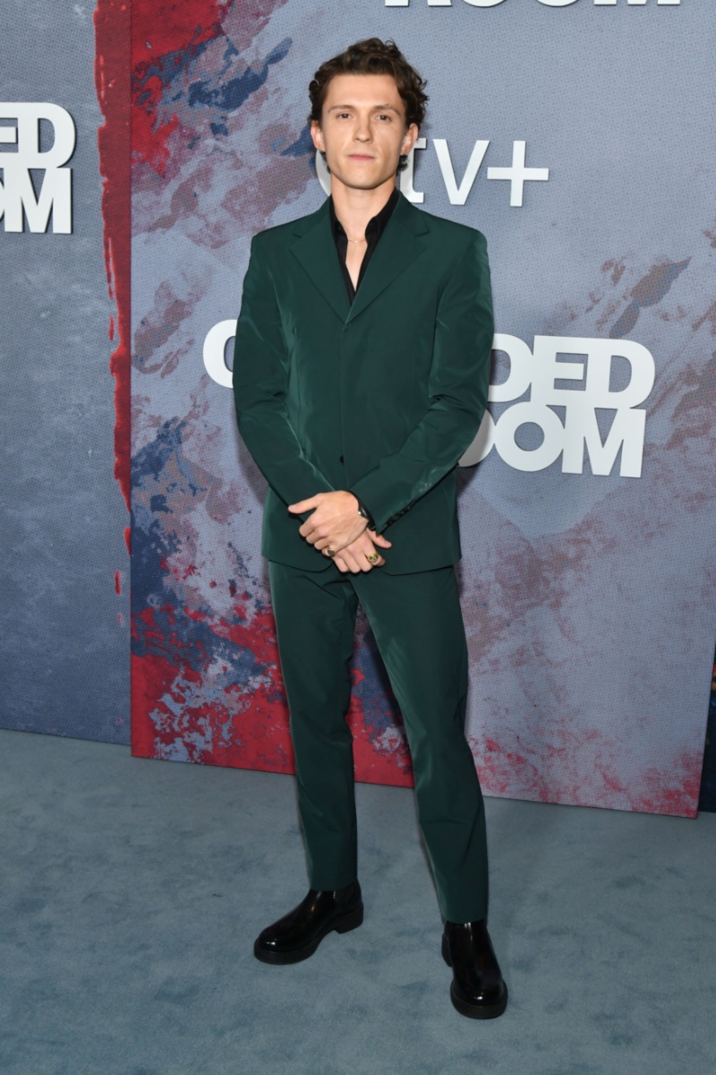 Tom Holland wears a dark green Prada suit for the premiere of The Crowded Room in New York City on June 1, 2023. 