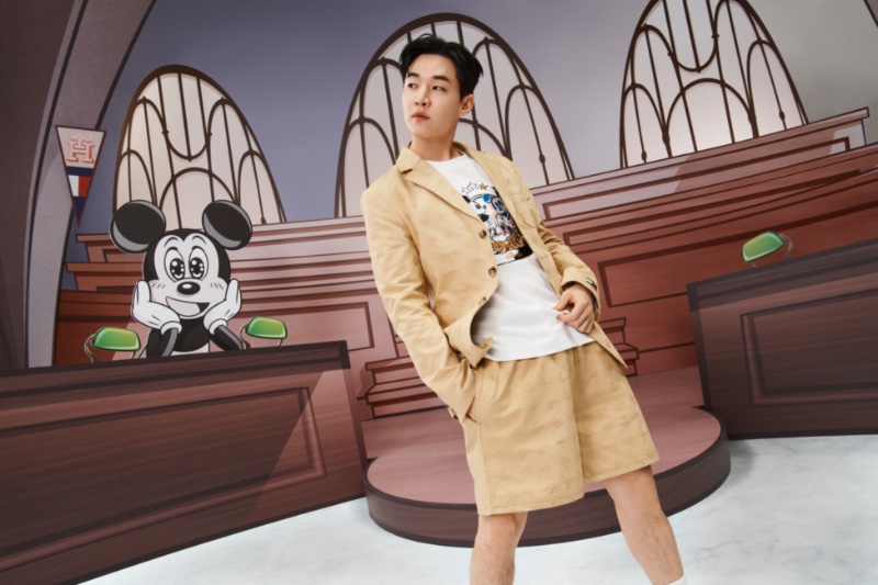 Singer Henry Lau wears a short suit for the Disney x Tommy collection campaign. 