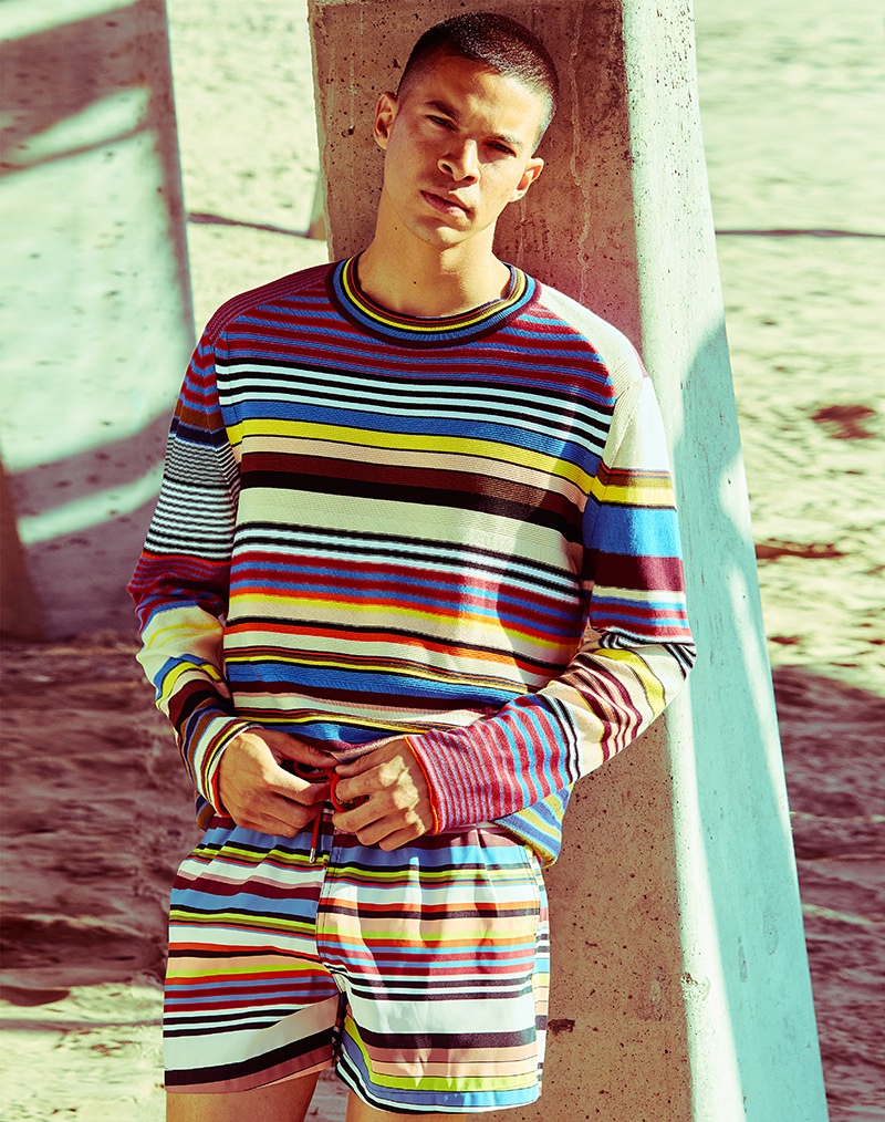 Tony wears striped sweater and swim trunks Paul Smith.