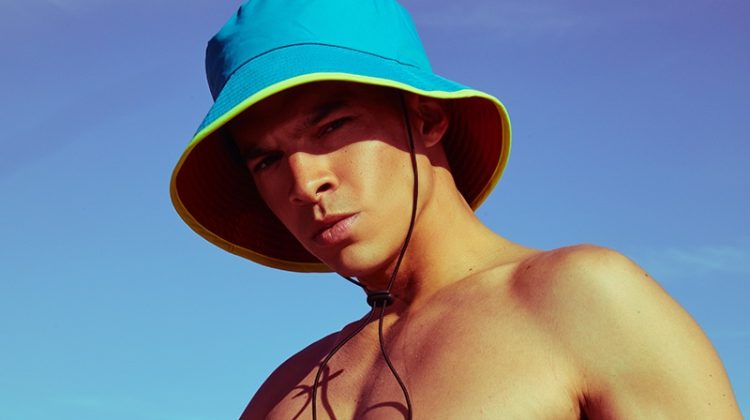 Tony wears bucket hat Zara x Rhuigi Villaseñor and vintage swim trunks Diesel.
