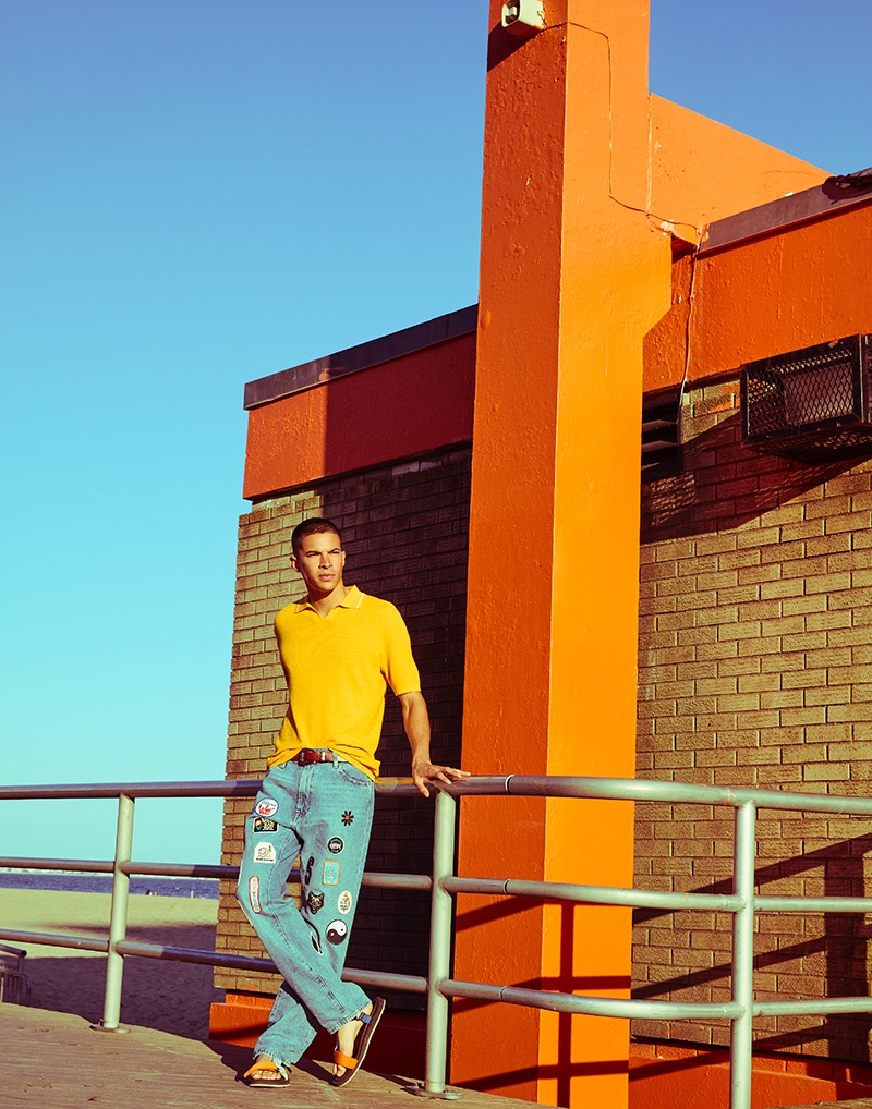 Tony wears polo Theory, patchwork denim jeans Levi's, and sandals Teva.