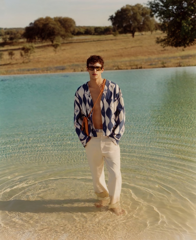 Habib Masovic wears a wave print overshirt and regular-fit jeans from "The Summer Escape" Zara collection.