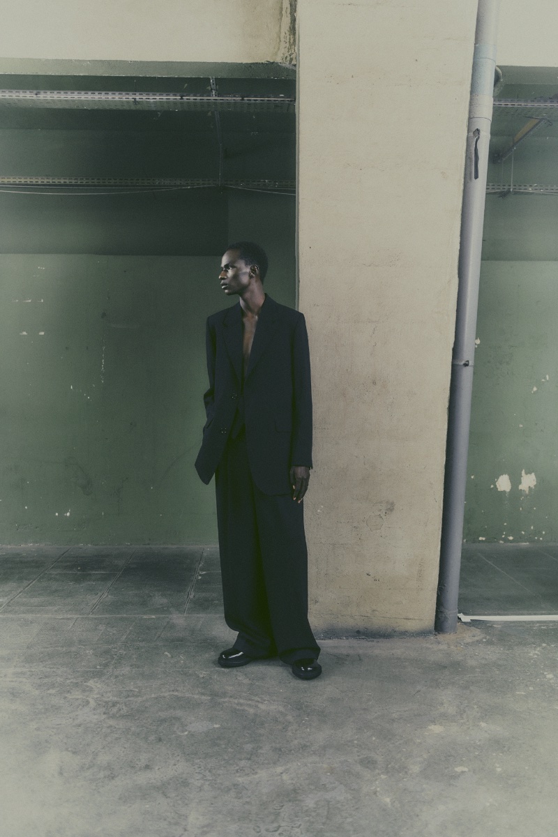 Malick Bodian showcases a black tailored number from AMI's spring-summer 2024 collection.