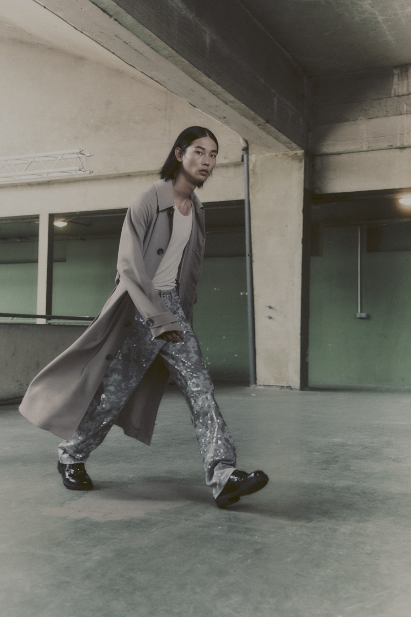 Taemin Park makes a statement in a long coat with sequined pants from AMI's spring-summer 2024 collection.