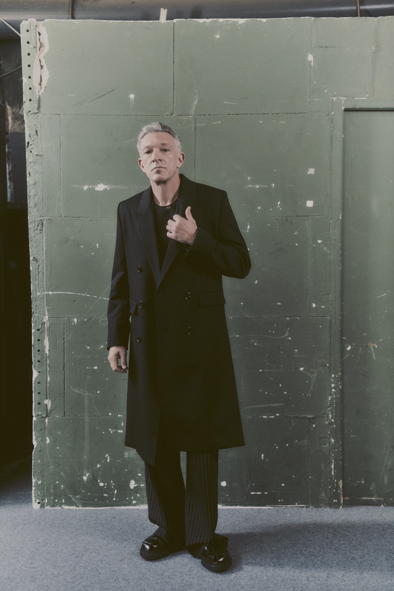 Vincent Cassel takes the spotlight in a black look from AMI's spring-summer 2024 collection.