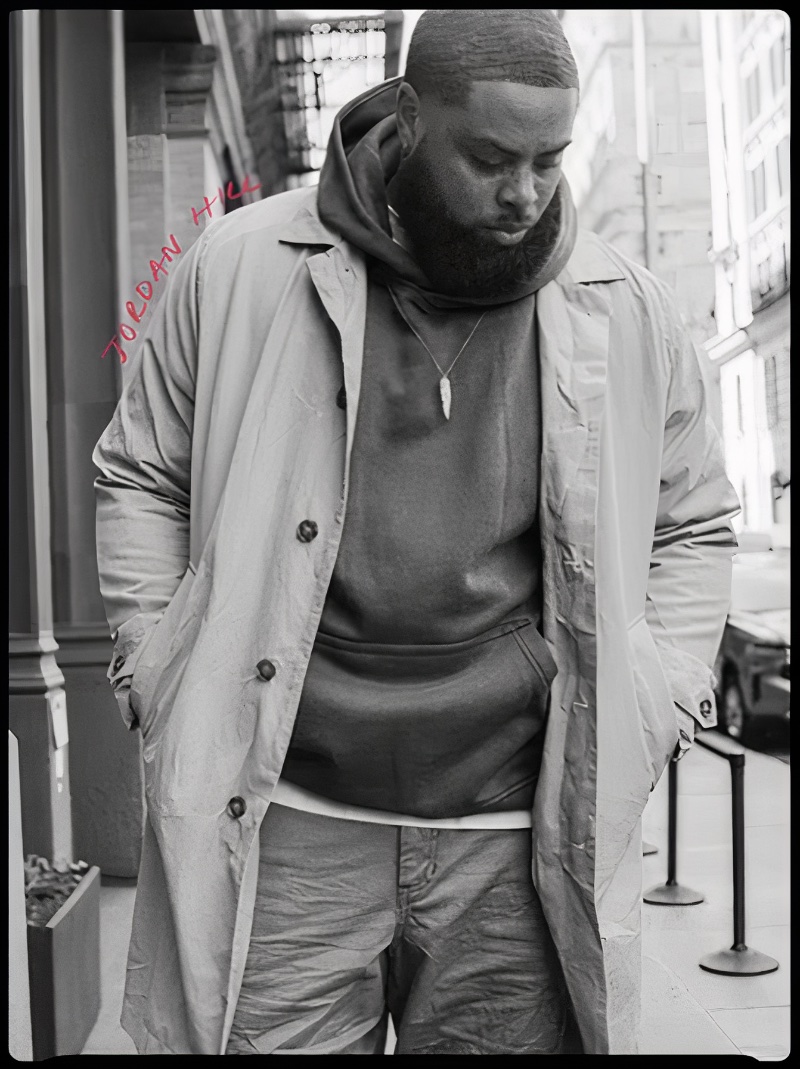 Jordan Hill sports a classic trench coat over a hoodie from the Abercrombie & Fitch Vintage Reissue collection.