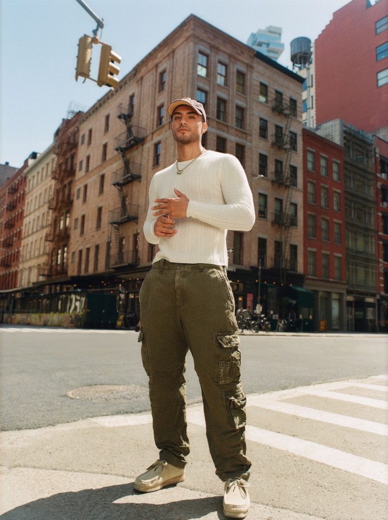 Cy Sandoval models a ribbed sweater with cargo pants from Abercrombie & Fitch's Vintage Reissue collection.