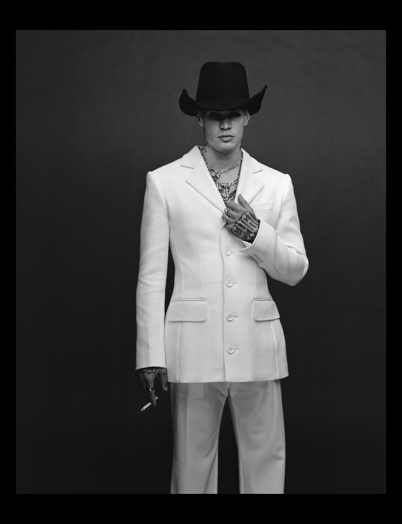 Starring in a new VMAN photoshoot, Blanco wears a chic white suit and black wool hat by Dolce & Gabbana.