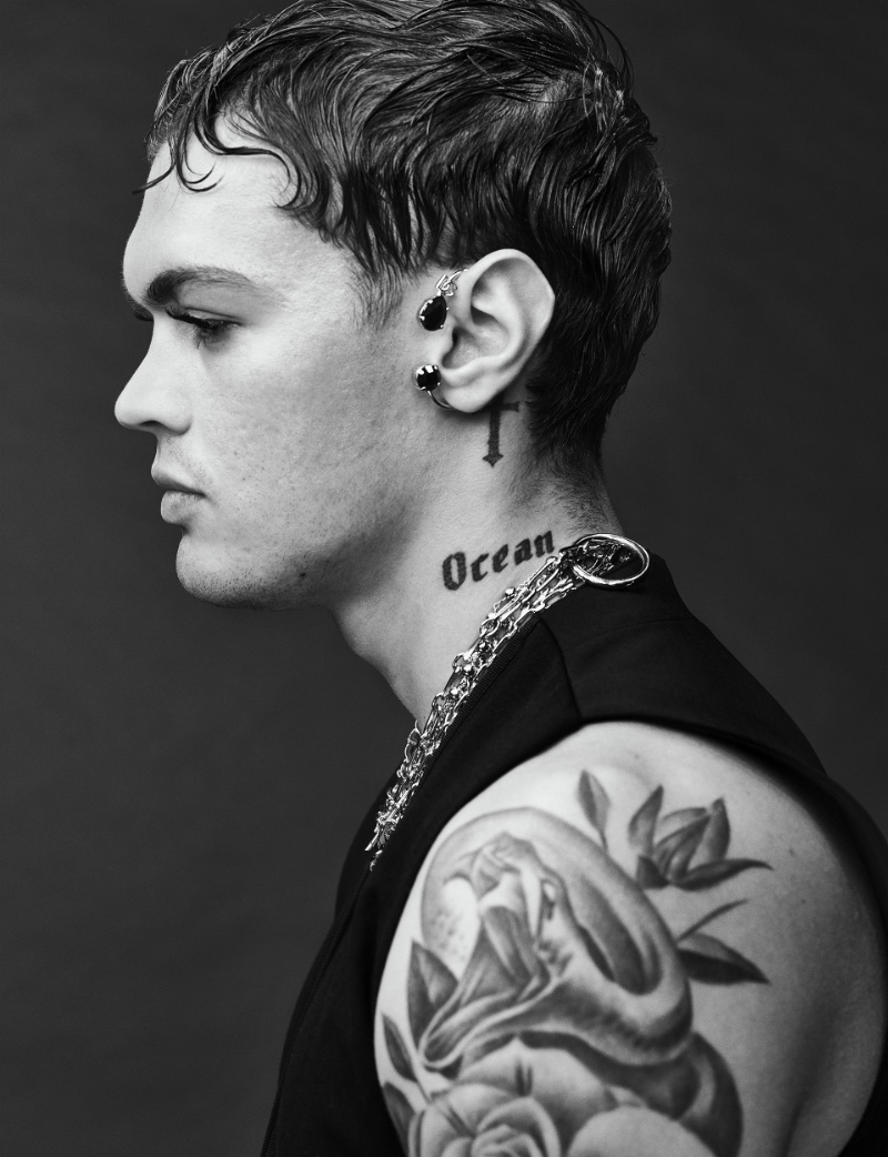 Italian rapper Blanco wears a vest and jewelry by Dolce & Gabbana.