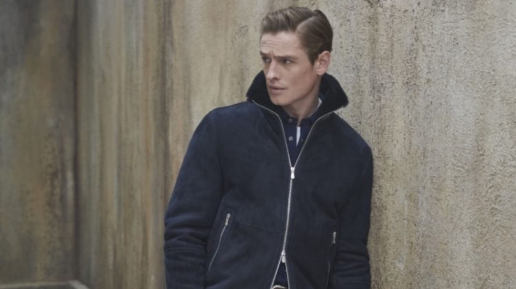 Patrick O'Donnell sports a shearling bomber jacket with jeans from Brunello Cucinelli's fall-winter 2023 collection for men.