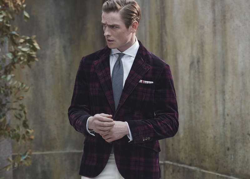 Model Patrick O'Donnell wears a check corduroy blazer from Brunello Cucinelli's fall-winter 2023 collection. 