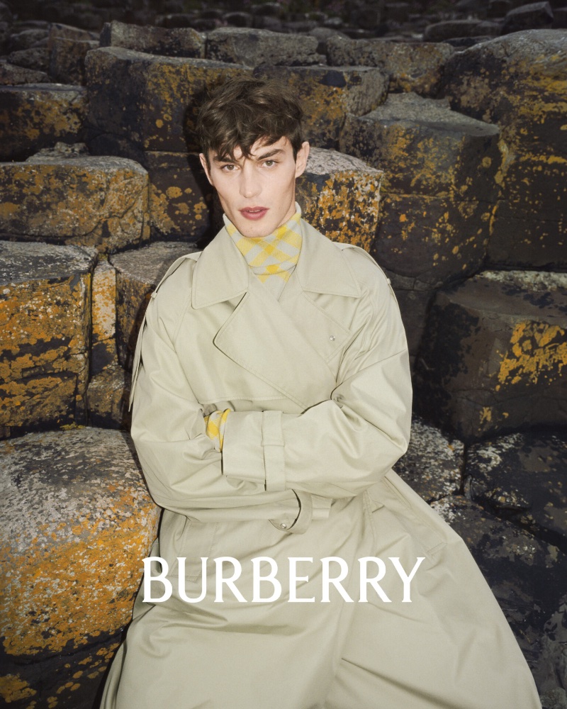British model Kit Butler sports an oversized trench for Burberry's winter 2023 campaign. 