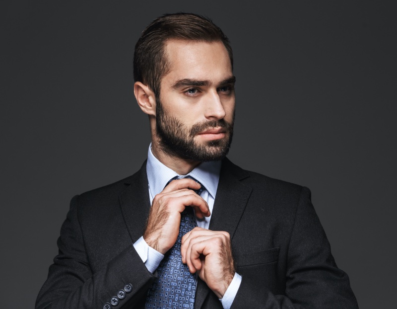 Business Professional Attire Men Adjusting Tie