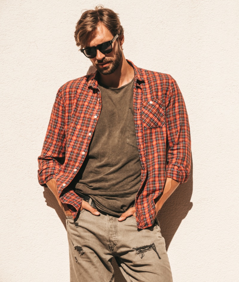 Men's casual outfits wear blue jeans with red plaid shirt, brown