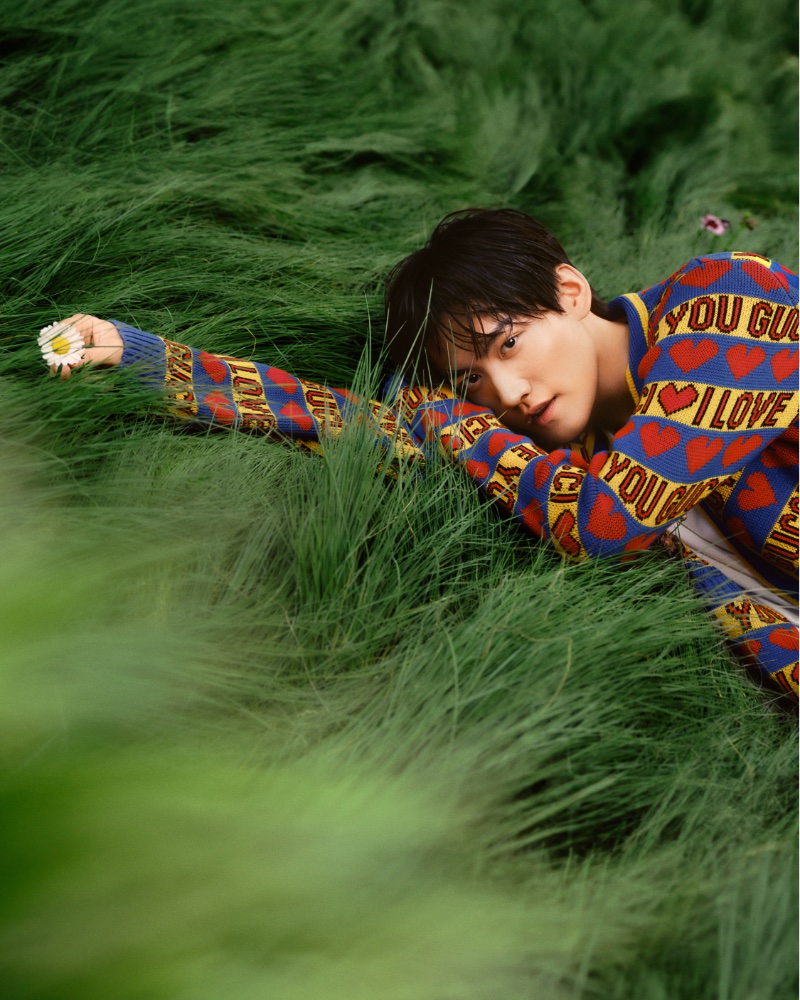 Singer and actor Daniel Zhou sports printed knitwear for Gucci's latest campaign.