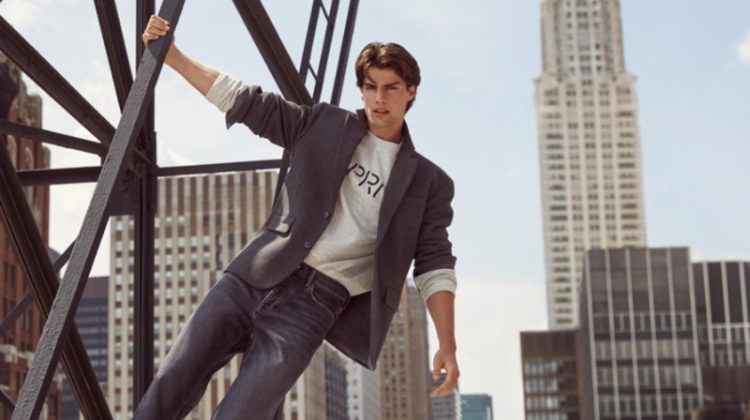 Sporting jeans with a sports coat, Corrado Martini fronts Esprit's fall 2023 campaign.