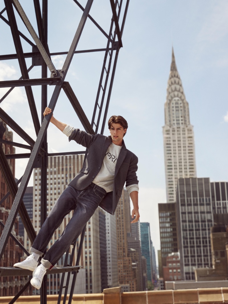 Sporting jeans with a sports coat, Corrado Martini fronts Esprit's fall 2023 campaign.