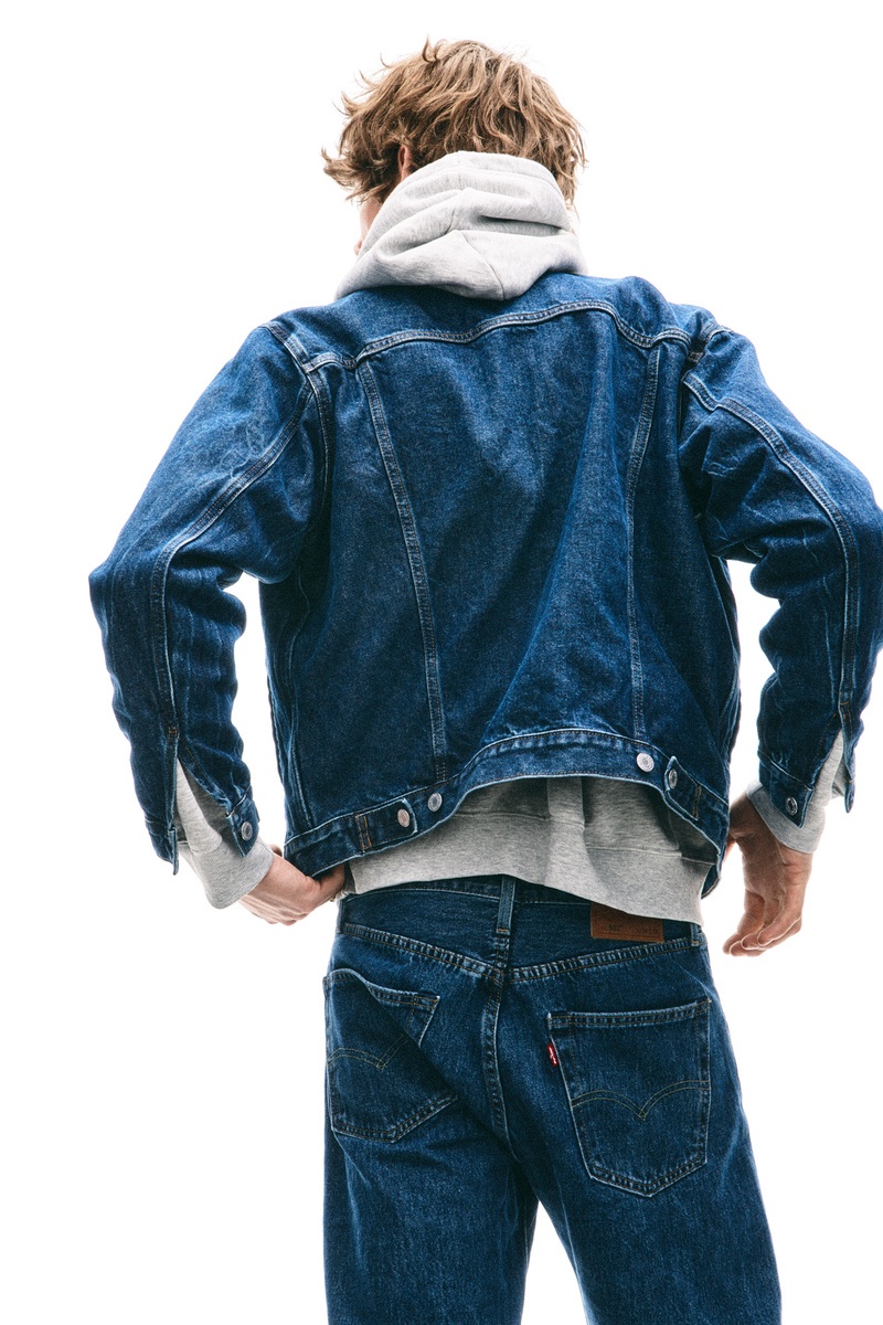 H&M spotlights Levi's jeans, pairing the style staple with its denim trucker jacket. 