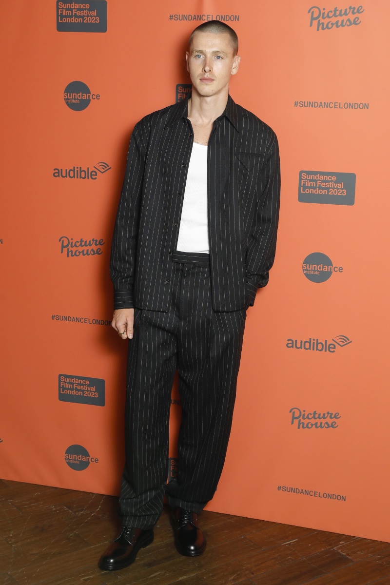 Harris Dickinson wears a pinstripe outfit by Bottega Veneta to attend Sundance Film Festival London for the Scrapper opening gala.