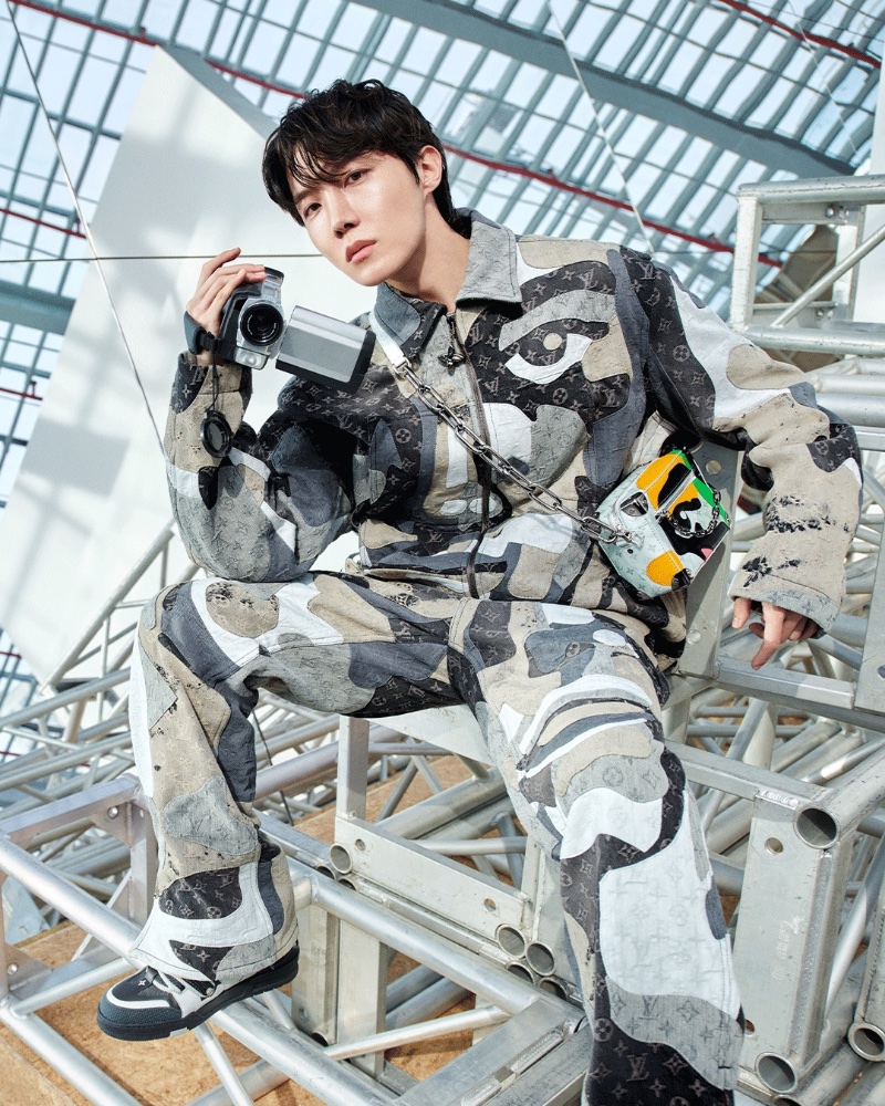J-Hope sports a monogram print outfit for Louis Vuitton's fall-winter 2023 campaign. 