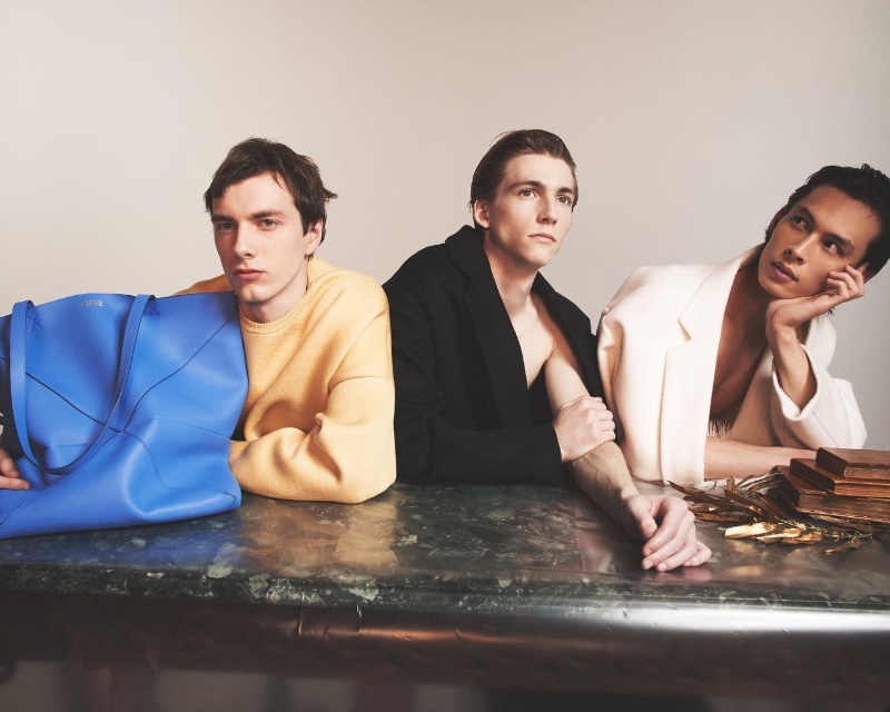 Models Adrians Smats, Elliott Raven Mcdean, and Yang Hao share the spotlight for Loewe's fall-winter 2023 campaign.