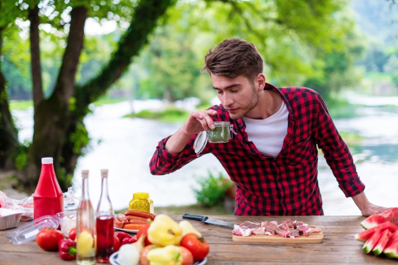 Man Cooking BBQ Outside