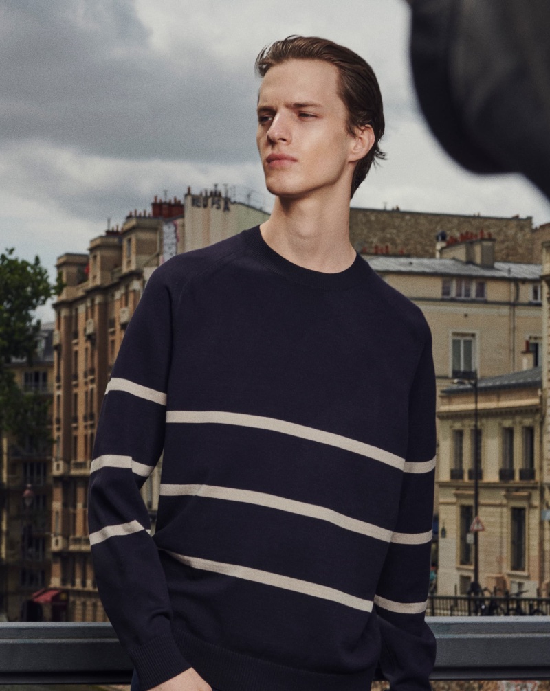 Massimo Dutti highlights transitional fashions with staples like the striped crewneck sweater. 