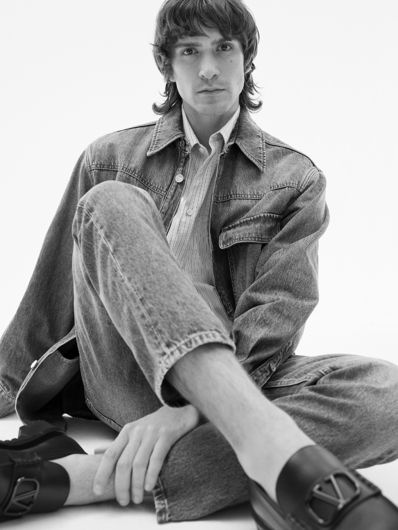 Ettore De Martino models a denim look from Valentino for Mytheresa's pre-fall 2023 campaign. 