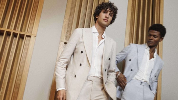 Models Francisco Henriques and O'Shea Robertson don REISS' double-breasted suiting.