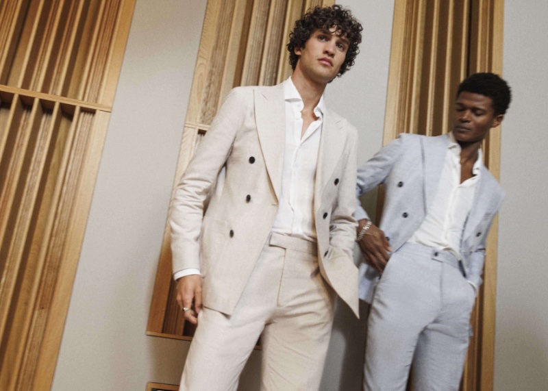 Models Francisco Henriques and O'Shea Robertson don REISS' double-breasted suiting. 