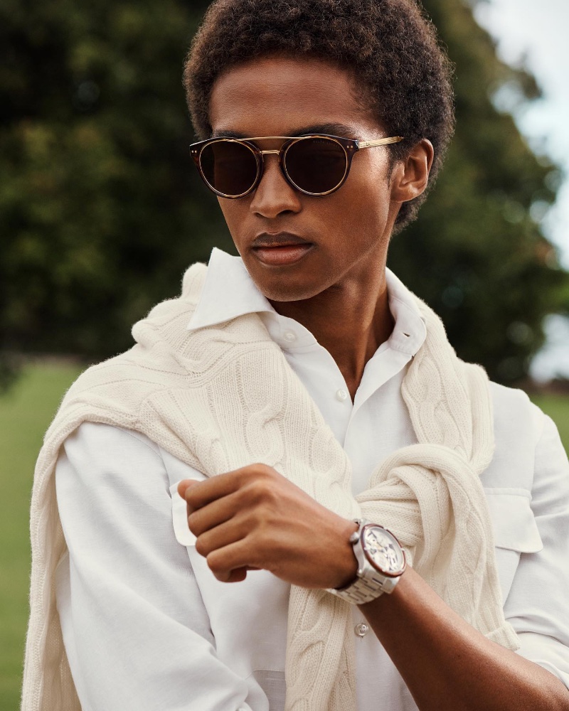 A smart vision in Ralph Lauren, Stan Taylor wears a shirt with a cable-knit sweater draped across his shoulders. » Ralph Lauren Channels Coastal Style with Effortless Elegance A smart vision in Ralph Lauren, Stan Taylor wears a shirt with a cable-knit sweater draped across his shoulders.