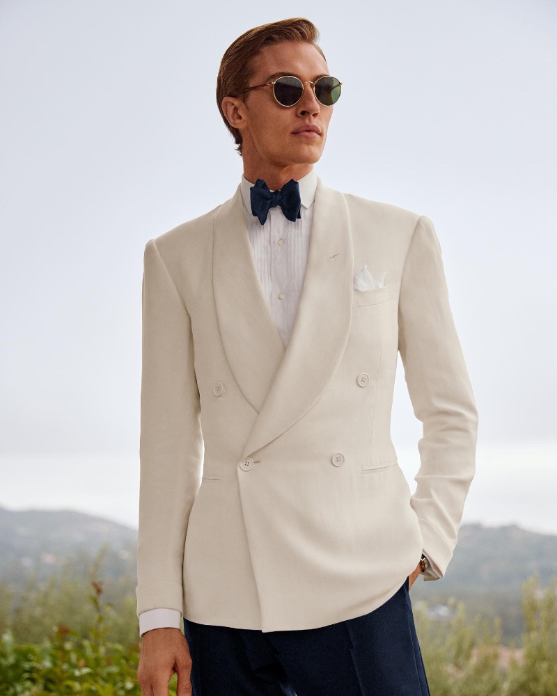 Lucky Blue Smith dons a cream-colored tuxedo jacket from the spring-summer 2023 Ralph Lauren Purple Label collection.
