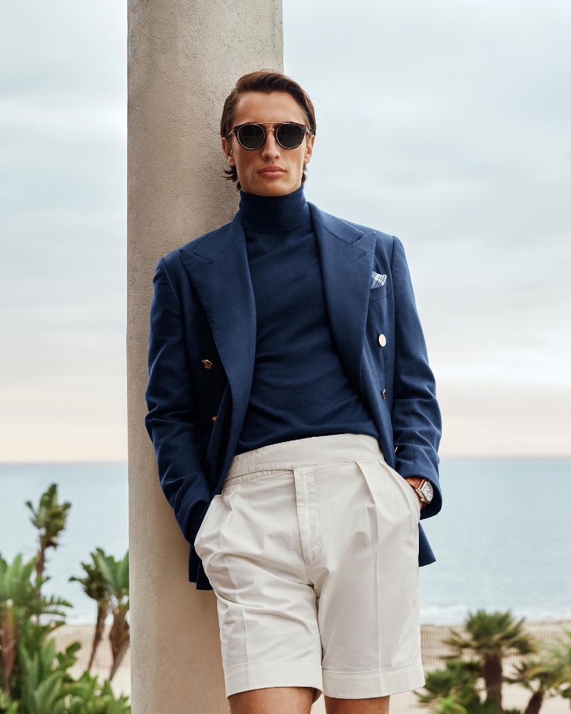 James Turlington models a navy and cream look from Ralph Lauren. 