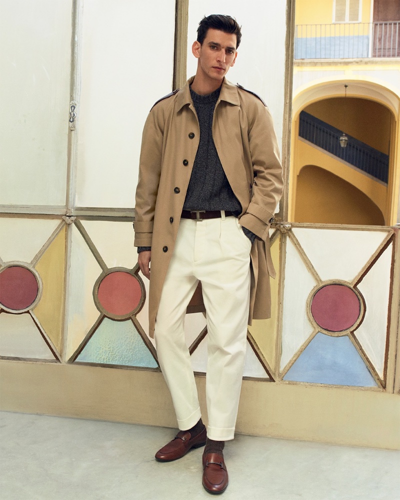 Thibaud Charon dons a trench and loafers for Tod's pre-fall 2023 campaign. 