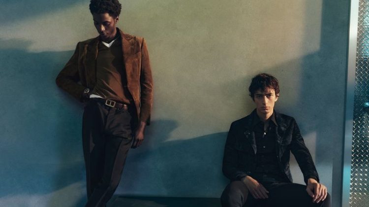 Models Ahmed Richards and Gena Malinin don neutral-colored tailoring for Tom Ford's pre-fall 2023 campaign.