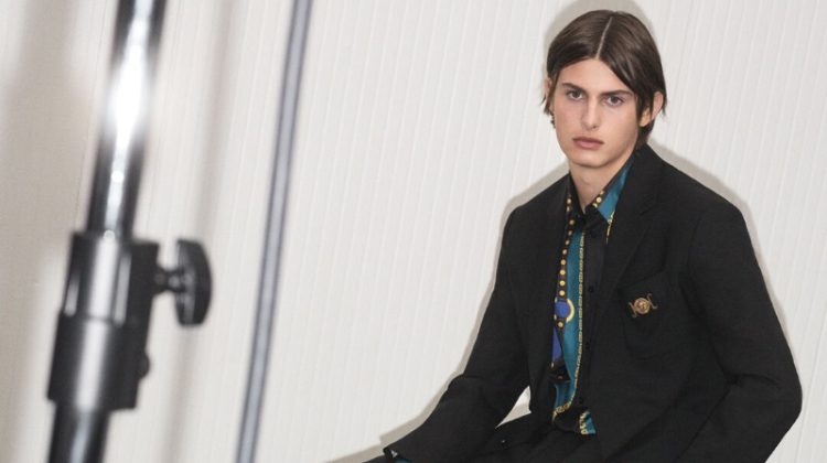 A sleek vision in black tailoring, Mark Vanderloo Jr. fronts the Versace pre-fall 2023 campaign.