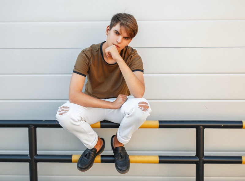 Man in white crew neck t-shirt and white pants standing near brown wall  photo – Free Blackman Image on Unsplash