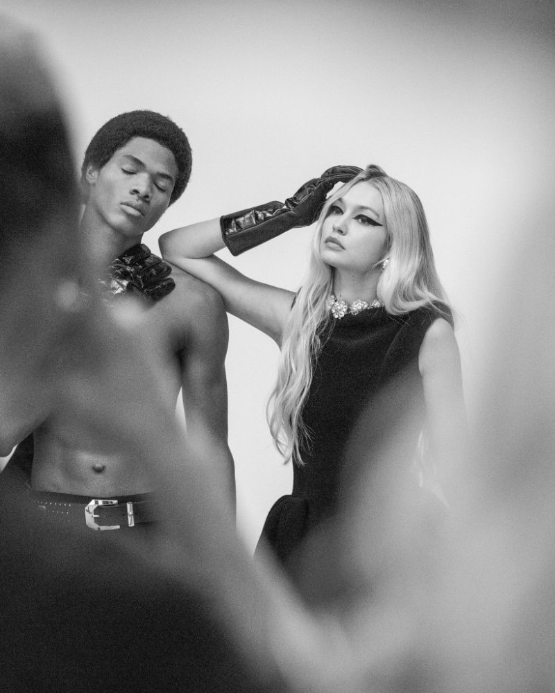 Behind the Scenes: Models Wylber Flores Marte and Gigi Hadid pose for Versace's fall-winter 2023 campaign. 