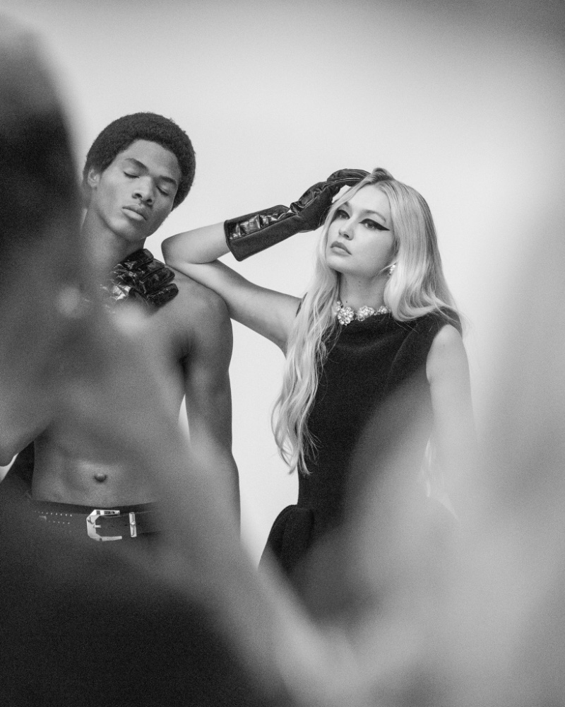 Behind the Scenes: Models Wylber Flores Marte and Gigi Hadid pose for Versace's fall-winter 2023 campaign. » Versace Fall 2023 Campaign: A Modern Declaration of Style Behind the Scenes: Models Wylber Flores Marte and Gigi Hadid pose for Versace's fall-winter 2023 campaign.