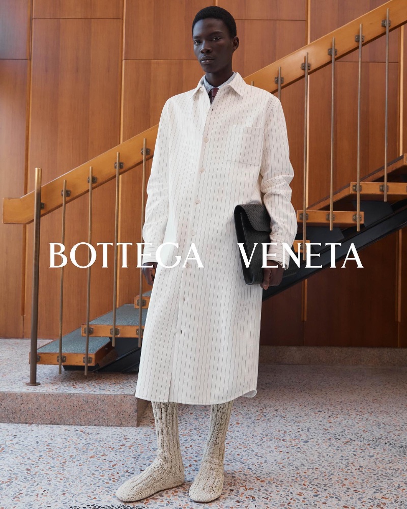 Dara Gueye dons a long shirt for Bottega Veneta's fall-winter 2023 campaign. 