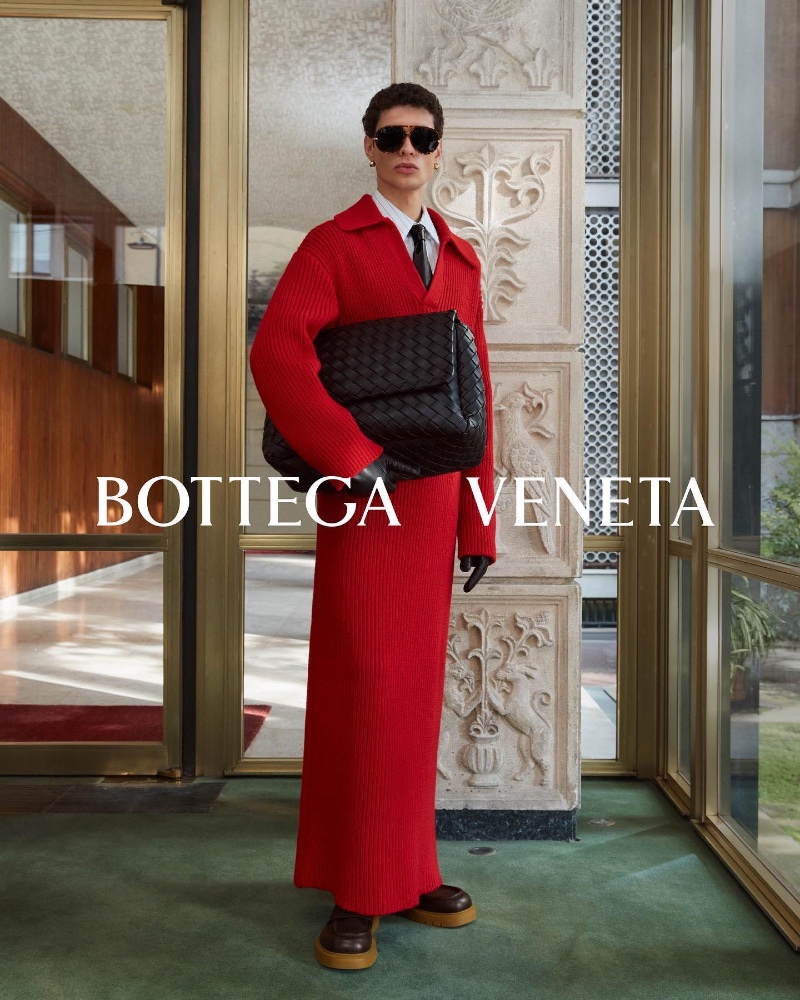 Making a statement in red, Tommaso Zana fronts Bottega Veneta's fall-winter 2023 campaign. 