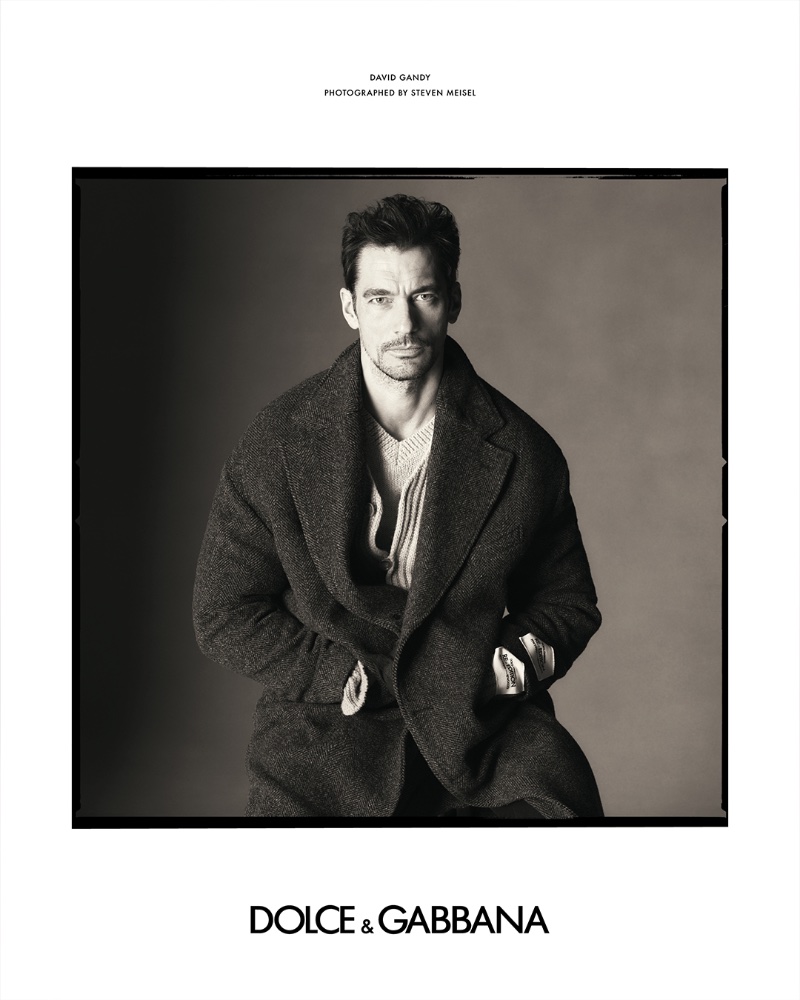 David Gandy dons a wool coat with knitwear for the Dolce & Gabbana fall-winter 2023 Re-Edition campaign. 