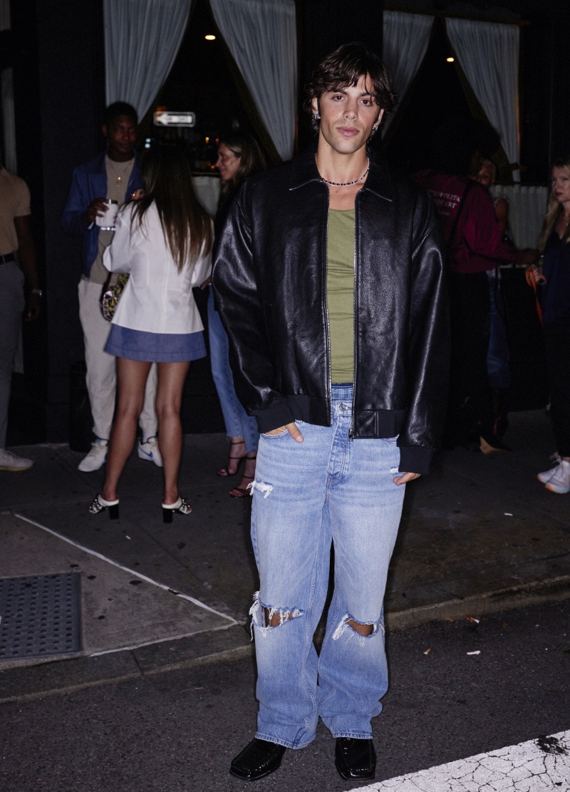 Stepping out to celebrate FRAME's Modern Man campaign, Gage Gomez channels Y2K style in baggy jeans and a leather jacket. 