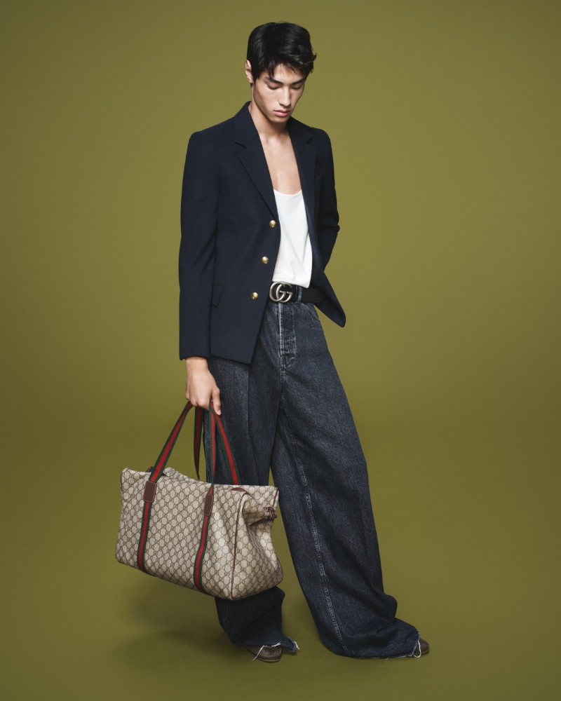 Model Brando Erba dons wide-leg jeans with a blazer for Gucci's fall-winter 2023 campaign.