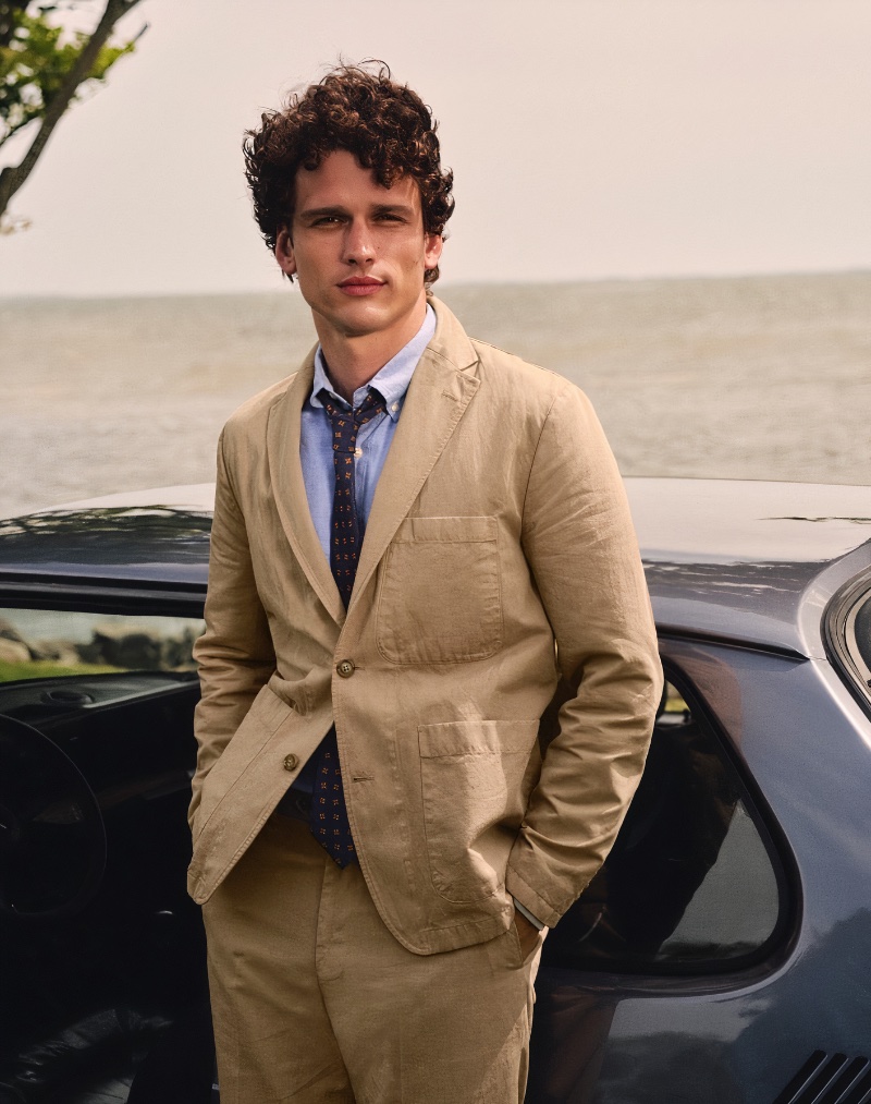 Model Simon Nessman wears a J.Crew garment-dyed chino suit with a broken-in organic cotton oxford and a wool tie.