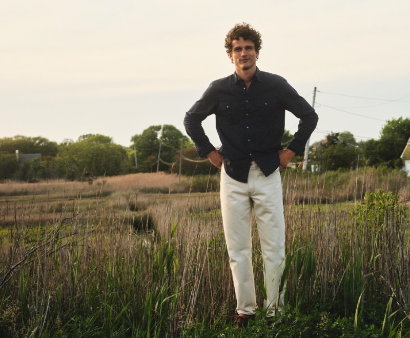 In front and center, Simon Nessman sports a J.Crew Heritage twill work shirt with a Classic jean and leather camp shoes.