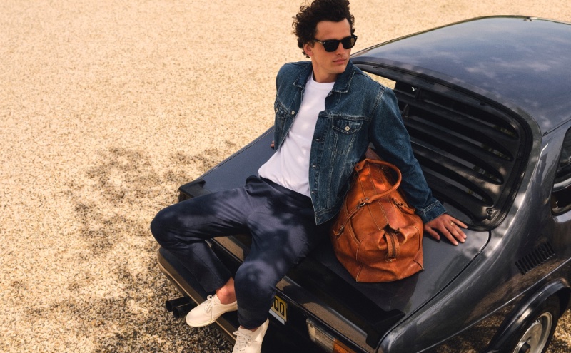 Going casual, Simon Nessman rocks a J.Crew denim jacket with a relaxed premium-weight cotton tee and a Tech Dock pant.