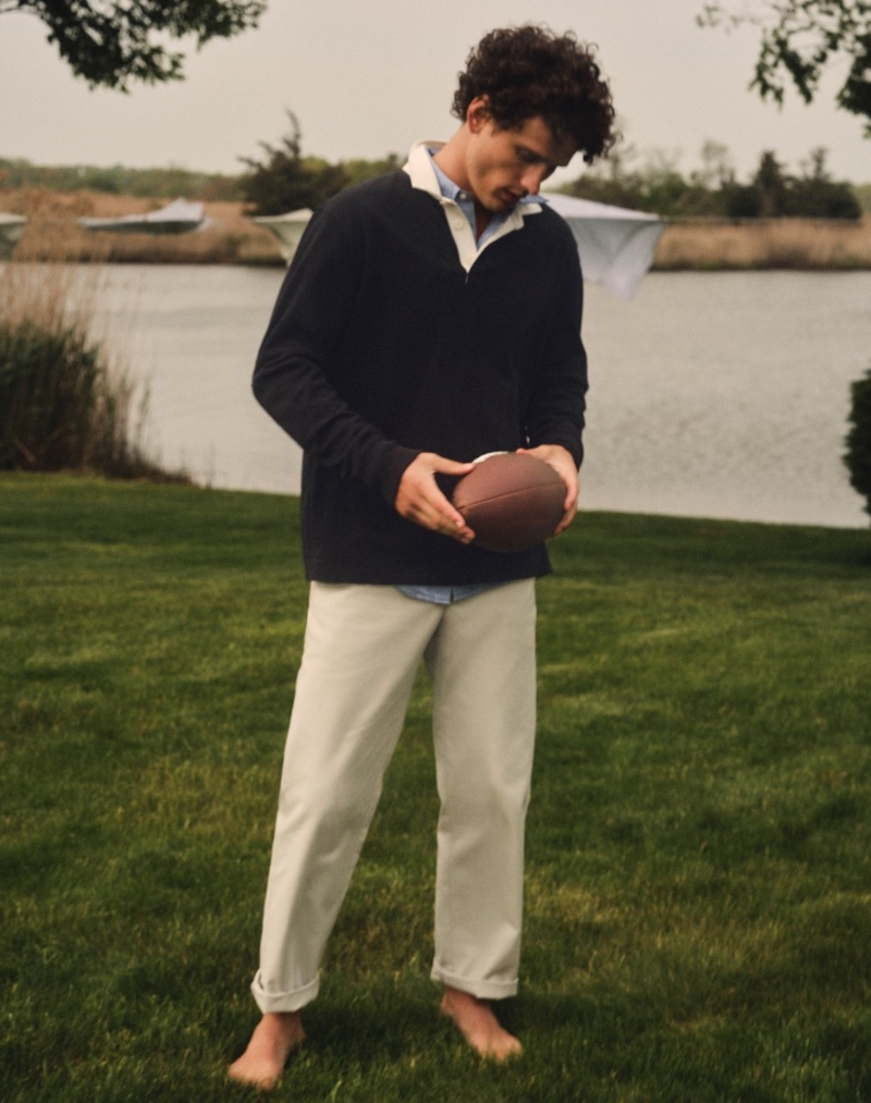 Embracing classic men's style, Simon Nessman dons a J.Crew rugby shirt with a Secret Wash cotton poplin shirt and a Classic chino. » J.Crew Fall 2023: Simon Nessman Models Preppy Classics Embracing classic men's style, Simon Nessman dons a J.Crew rugby shirt with a Secret Wash cotton poplin shirt and a Classic chino.